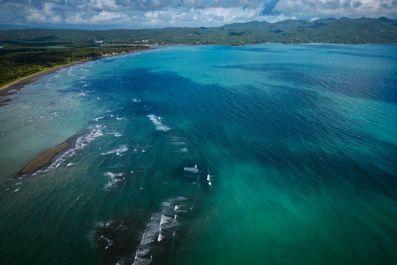 An oil slick from the sunken tanker MT Princess Empress mars the shoreline in Pola, the Philippines. Getty Images