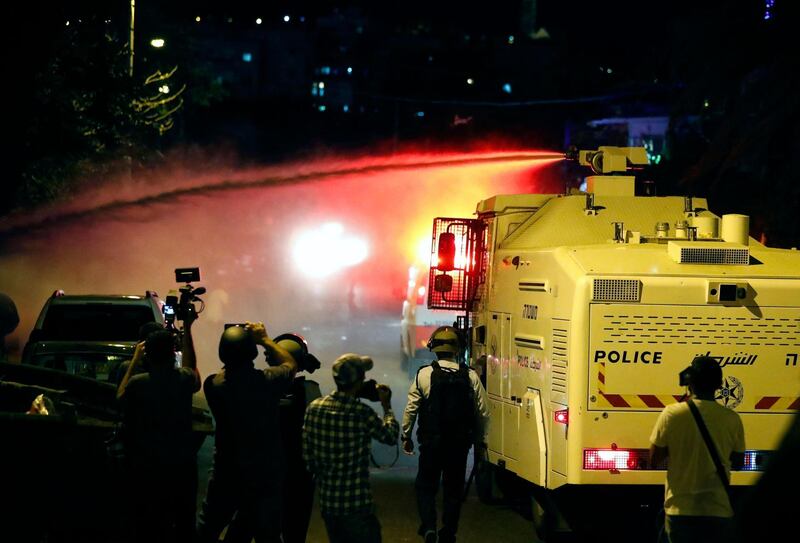 Israeli security forces spray Palestinian protesters with 'skunk water' in Sheikh Jarrah. AFP