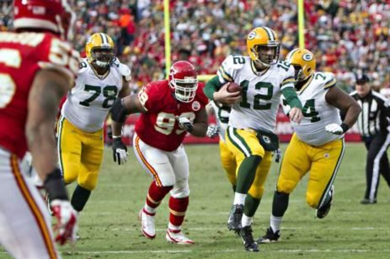 KANSAS CITY, MO - DECEMBER 18: Aaron Rodgers #12 of the Green Bay Packers runs the ball against the Kansas City Chiefs at Arrowhead Stadium on December 18, 2011 in Kansas CIty, Missouri. The Chiefs defeated the Packers 19-14.   Wesley Hitt/Getty Images/AFP