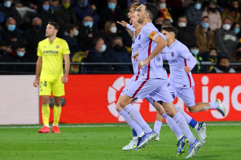 Barcelona's Dutch midfielder Frenkie De Jong celebrates with teammates scoring. AP Photo