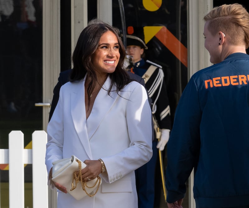 Meghan, Duchess of Sussex, arrives at the Invictus Games venue in The Hague, the Netherlands, in a white Valentino suit. AP