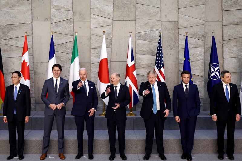 From left, Japanese Prime Minister Fumio Kishida, Canadian Prime Minister Justin Trudeau, US  President Joe Biden, German Chancellor Olaf Scholz, British Prime Minister Boris Johnson, French President Emmanuel Macron and Italian Prime Minister Mario Draghi pose for a family photo during the G7 summit in Brussels, Belgium. Reuters
