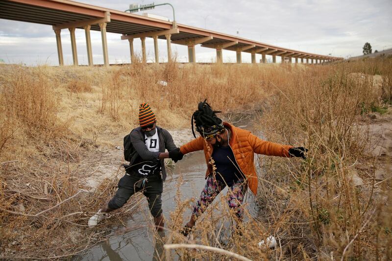 Migrants cross the Rio Bravo river to turn themselves in to the authorities and request asylum in El Paso, Texas, US, as seen from Ciudad Juarez, Mexico. Reuters