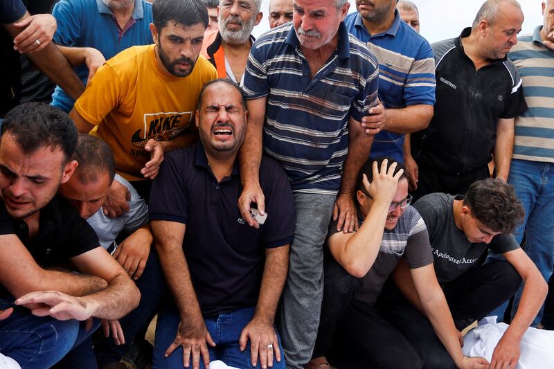 Palestinian mourners during the funerals of Al-Agha family members killed in Israeli strikes in Khan Younis in the southern Gaza Strip. Reuters