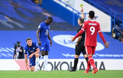 Soccer Football - Premier League - Chelsea v Liverpool - Stamford Bridge, London, Britain - September 20, 2020 Chelsea's Andreas Christensen is shown a yellow card by referee Paul Tierney Pool via REUTERS/Michael Regan EDITORIAL USE ONLY. No use with unauthorized audio, video, data, fixture lists, club/league logos or 'live' services. Online in-match use limited to 75 images, no video emulation. No use in betting, games or single club/league/player publications.  Please contact your account representative for further details.