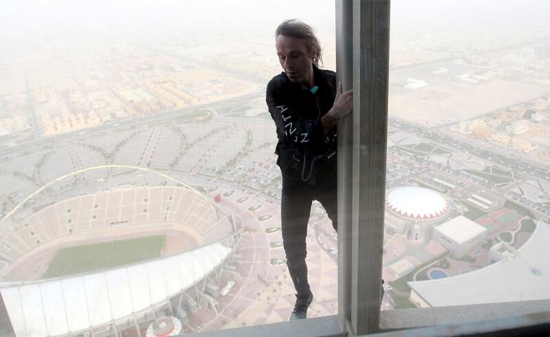 The ‘French Spiderman’, climbs 300 meters up The Torch hotel in Doha on 12 April, 2012. He took 75 minutes to complete his first climb in Qatar. Faisal Al Tamimi / AFP Photo