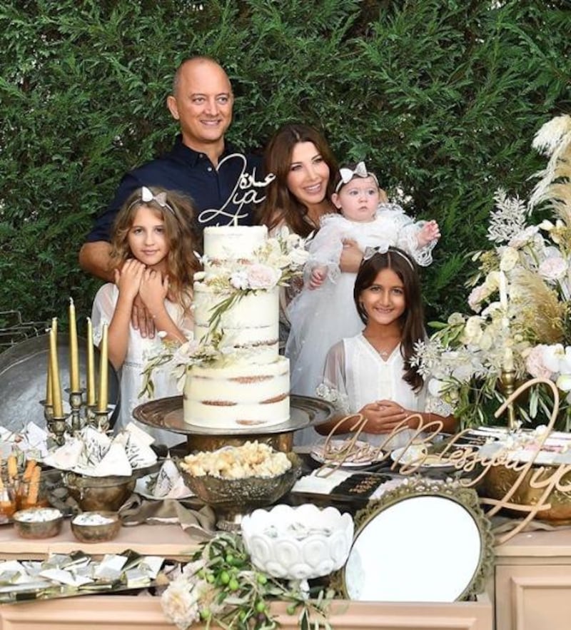 Nancy Ajram with her three daughters and husband at her youngest daughter, Lya's, christening. Instagram / Nancy Ajram 
