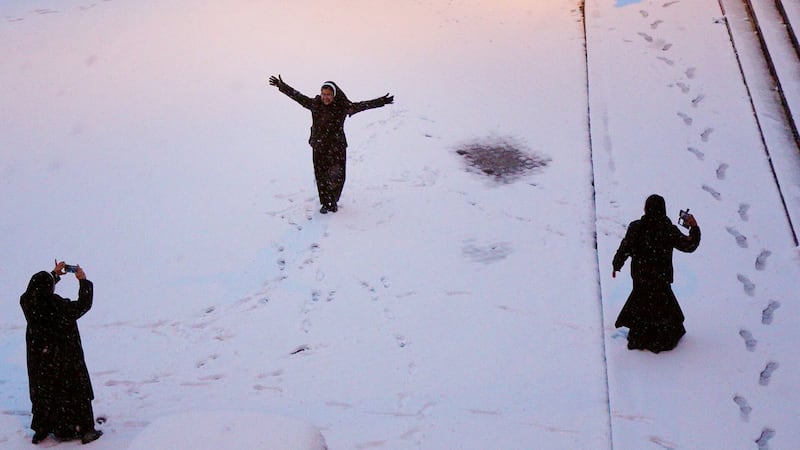 Women play in the snow. Photo: @Sebusher via Twitter