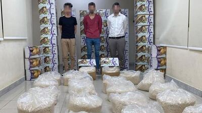 Three men who allegedly tried to smuggle more than 2.2 million Captagon tablets in boxes labeled as containing dried apricots, were arrested by Abu Dhabi Police in May. Courtesy: Abu Dhabi Police.