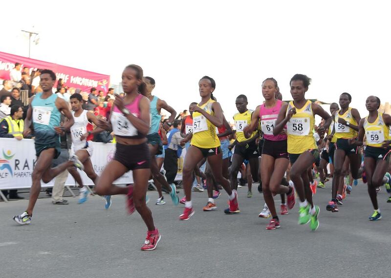Elite runners from Africa lead the way at the start of the Ras Al Khaimah Half Marathon. Jeffrey E Biteng / The National