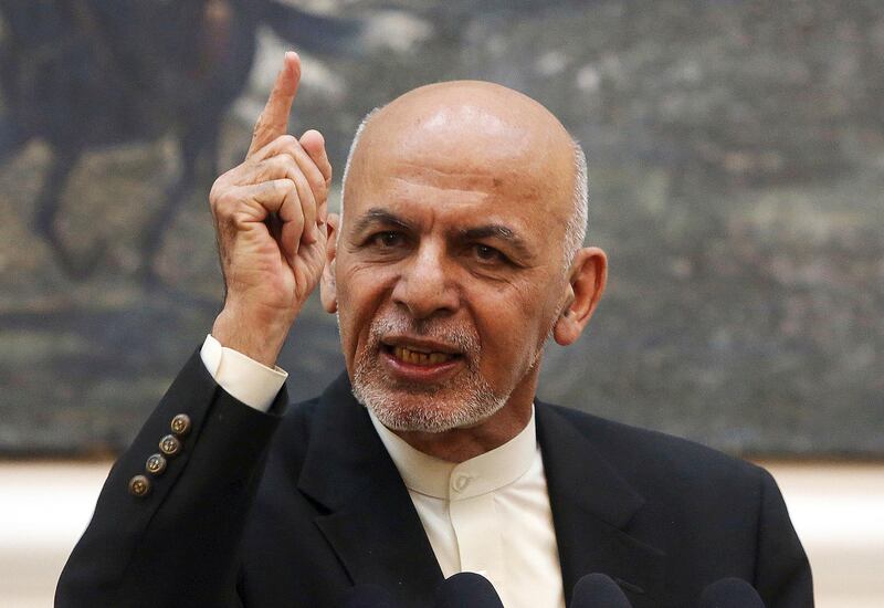 FILE - In this July 15, 2018, file photo, Afghan President Ashraf Ghani speaks during a press conference at the presidential palace in Kabul, Afghanistan. The Afghan government has fired its election commission, Tuesday, Feb. 12, 2019. The move by Ghaniâ€™s administration comes more than three months after chaotic parliamentary elections -- the results of which have still not been announced -- and ahead of Julyâ€™s controversial presidential vote. (AP Photo/Rahmat Gul, File)
