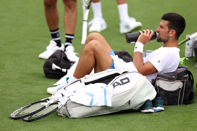 Serbia's Novak Djokovic takes a break during training. Getty