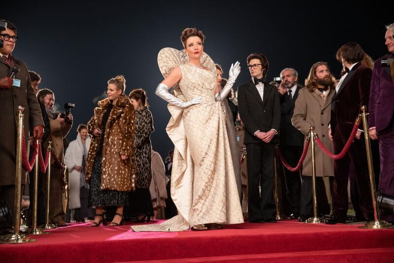 Emma Thompson as the Baroness and Andrew Leung as Jeffrey in Disney’s live-action CRUELLA. Photo by Laurie Sparham. © 2021 Disney Enterprises, Inc. All Rights Reserved.