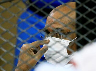 FILE PHOTO: Sudan's ousted president, Omar al-Bashir, is seen inside the defendant's cage during his and some of his former allies' trial over the 1989 military coup that brought him to power, at a courthouse in Khartoum, Sudan, September 15, 2020. REUTERS/Mohamed Nureldin Abdallah/File Photo