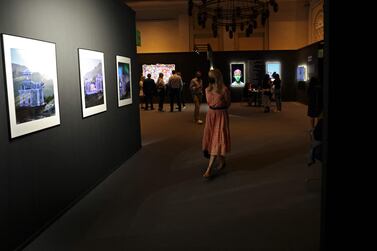 Visitors tour the 15th edition of Art Dubai at Madinat Jumeirah in the Gulf emirate of Dubai, on March 10, 2022.  (Photo by Karim SAHIB  /  AFP)  /  RESTRICTED TO EDITORIAL USE - MANDATORY MENTION OF THE ARTIST UPON PUBLICATION - TO ILLUSTRATE THE EVENT AS SPECIFIED IN THE CAPTION