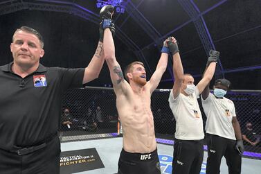 Cory Sandhagen has his arm raised in triumph after his victory over Marlon Moraes in their bantamweight bout during UFC Fight Night in Abu Dhabi. Josh Hedges / Zuffa LLC