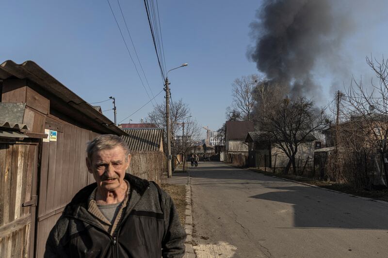 A man walks at a residential district that was damaged by shelling, as Russia's invasion of Ukraine continues, in Kyiv, Ukraine. Reuters