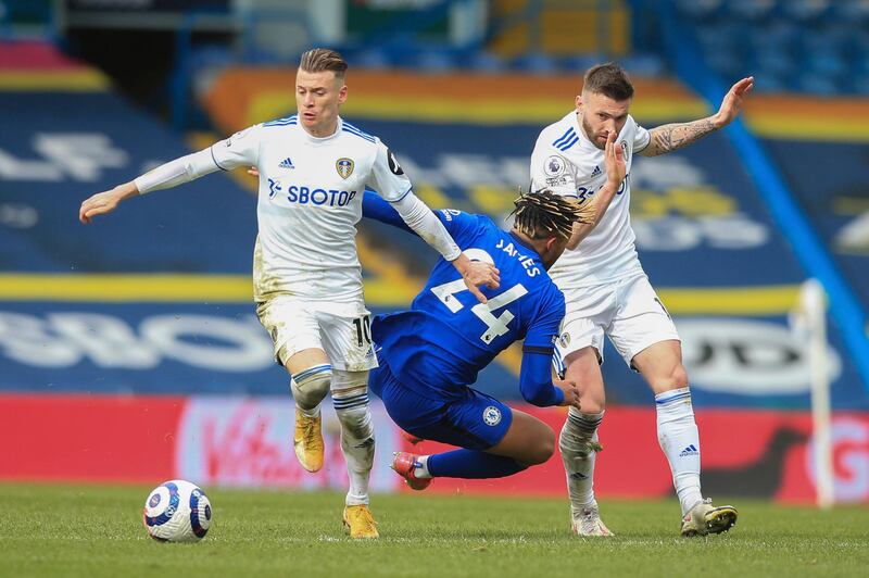 Chelsea's Reece James, centre, challenges for the ball with Leeds United's Ezgjan Alioski, left and Mateusz Klich at the Elland Road Stadium. AP