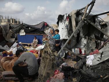 FILE - Displaced Palestinians inspect their tents destroyed by Israel's bombardment, adjunct to an UNRWA facility west of Rafah city, Gaza Strip, Tuesday, May 28, 2024.  (AP Photo / Jehad Alshrafi, File)