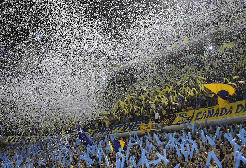 Fans of Boca Juniors cheer before the all-Argentine Copa Libertadores semi-final second leg football match against River Plate at La Bombonera stadium in Buenos Aires, on October 22, 2019. / AFP / Juan MABROMATA

