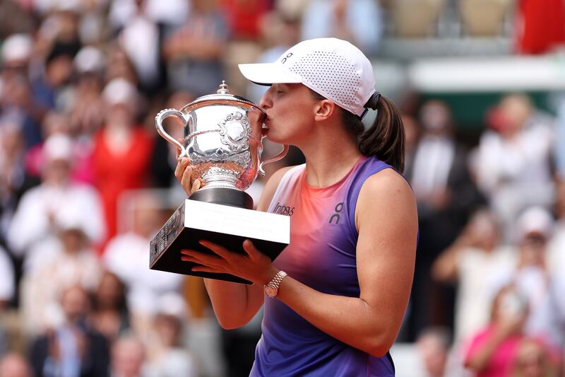 Iga Swiatek celebrates after beating Jasmine Paolini 6-2, 6-2 to win the French Open for a third year in a row. Getty Images