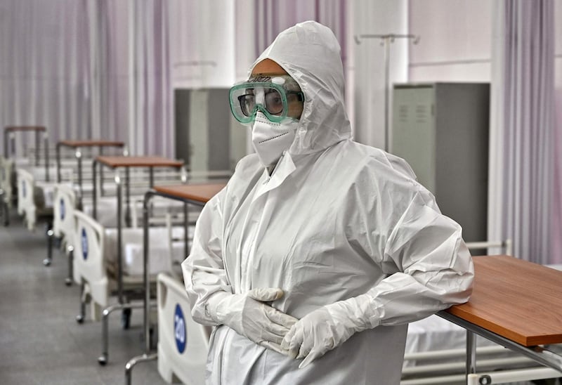 A health worker remains at the COVID-19 Hospitalization Operational Unit of the Military Field 1, at the National Defense Secretariat in Mexico City.  The facility, originally a dormitory for the 6th Mortar Group, was adapted to serve high, medium and low severity COVID-19 patients.  AFP