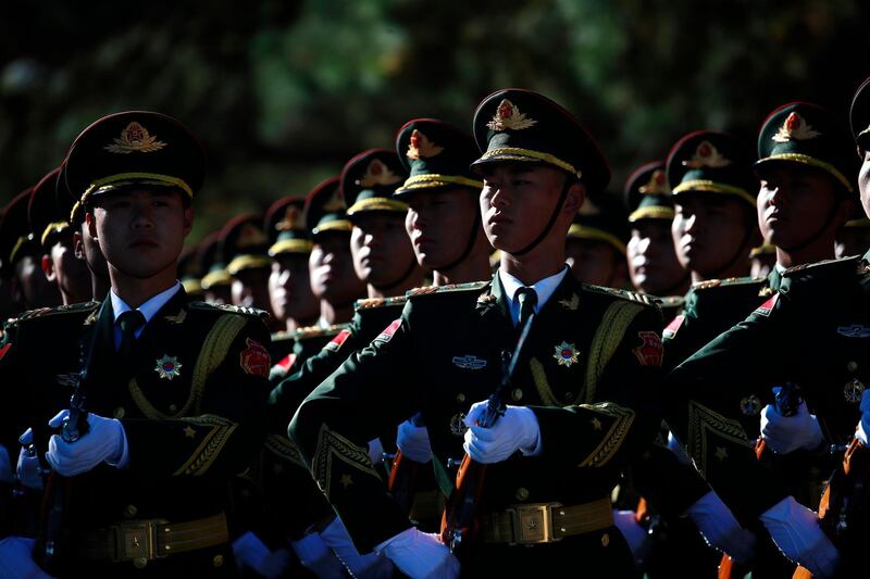 Chinese honor guards rehearse before a welcoming ceremony for Japanese Prime Minister Shinzo Abe (not pictured) at the Great Hall of the People in Beijing. Abe is in China for an official visit from 25 to 27 October.  EPA