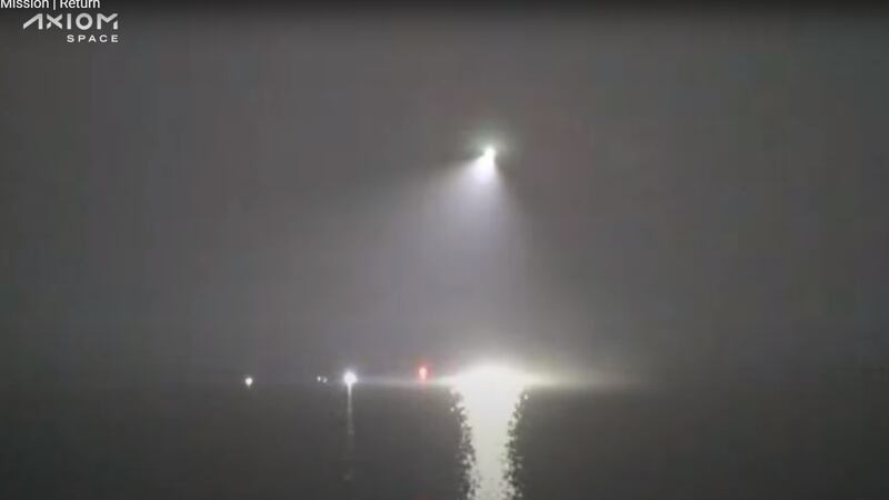 Searchlights over the area the capsule splashed down