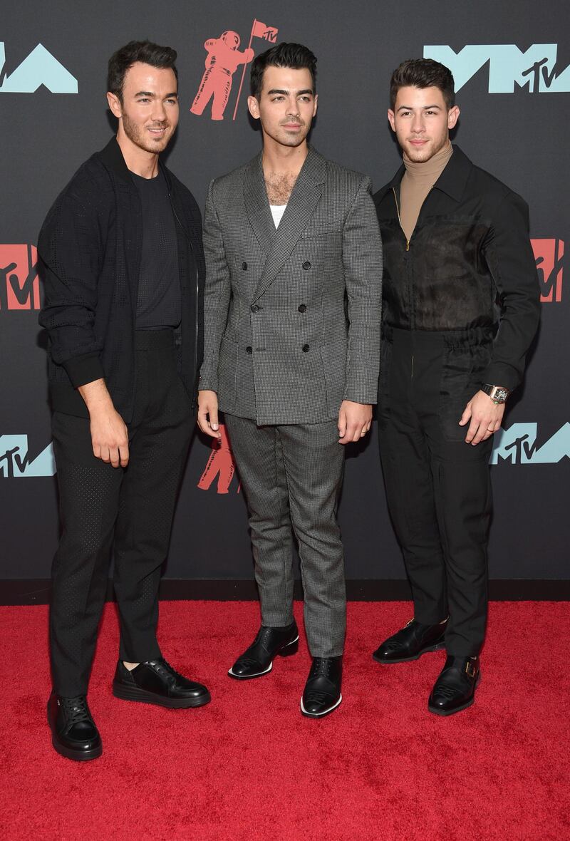 Kevin Jonas, Joe Jonas and Nick Jonas, of the Jonas Brothers, arrive at the MTV Video Music Awards on Monday, August 26. AP
