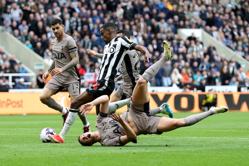 Alexander Isak of Newcastle United scores his team's first goal as Micky van de Ven of Tottenham Hotspur loses his footing. Getty Images