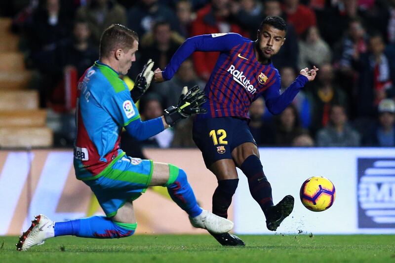 Barcelona's Rafinha is challenged by Rayo Vallecano's David Cobeno. Getty Images