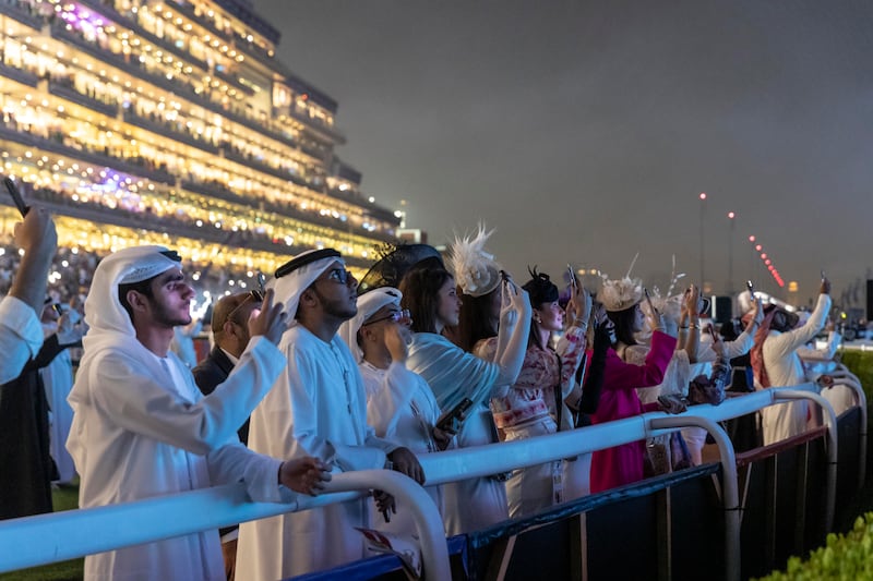 Racing fans watch the firework display