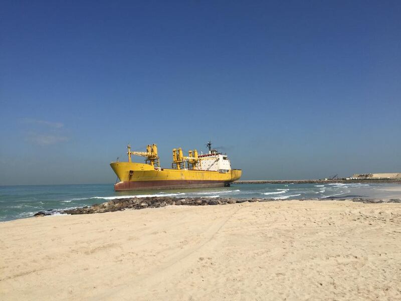 A ship that ran aground on Al Hamriya beach on Saturday. Thaer Zriqat / The National