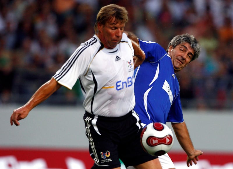 Bernd Foerster (L) of Germany fights for the ball with Paolo Rossi of Italy during a replay of the 1982 soccer World Cup match in Stuttgart July 27, 2007.             REUTERS/Alex Grimm (GERMANY)