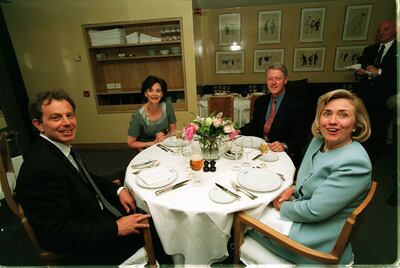 Bill Clinton and Tony Blair with their wives in London in the 1990s. Getty Images