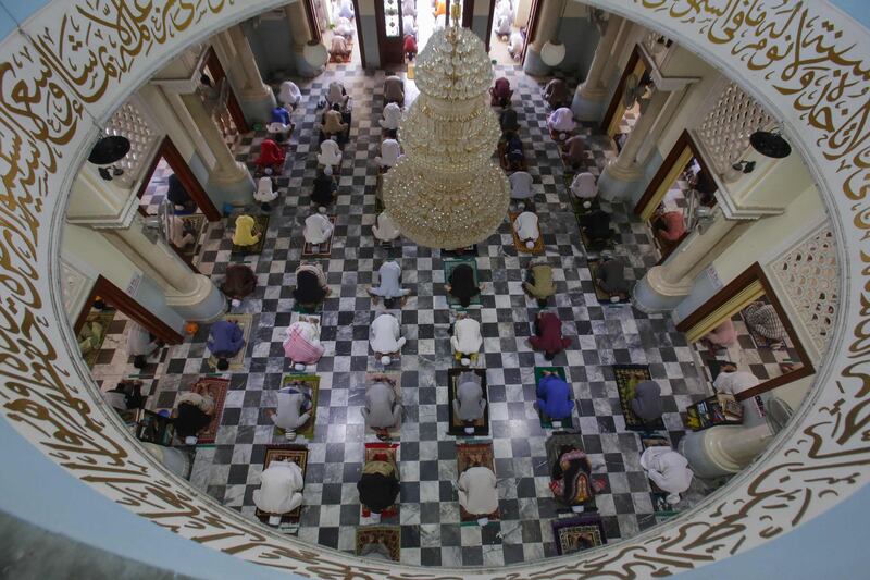 Muslim men observe social distancing at the Pattani Central Mosque in Pattani, Thailand.  AFP