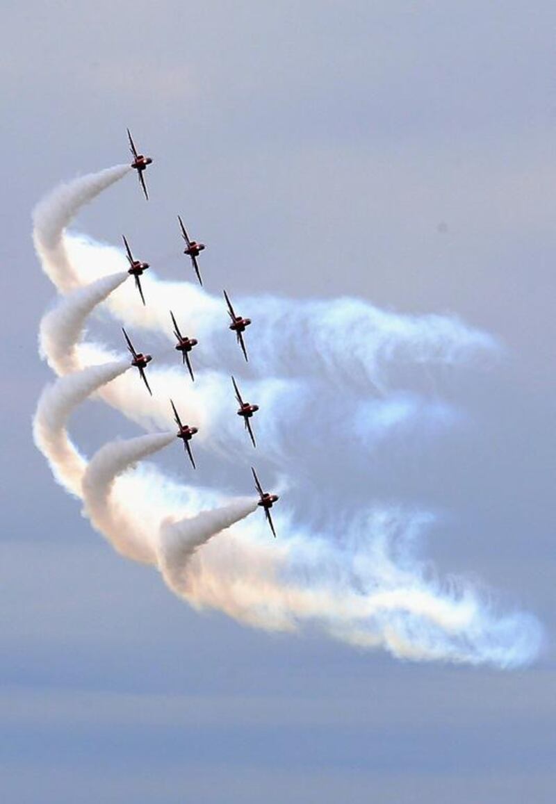 The RAF Red Arrows Display team fly in formation at the Royal International Air Tattoo at RAF Fairford on July 11, 2014 in Fairford, England. Chris Jackson / Getty Images