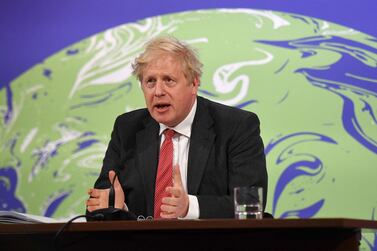 Britain's Prime Minister Boris Johnson speaks during the opening session of the virtual US Leaders’ Summit on Climate from the Downing Street briefing room. AFP.
