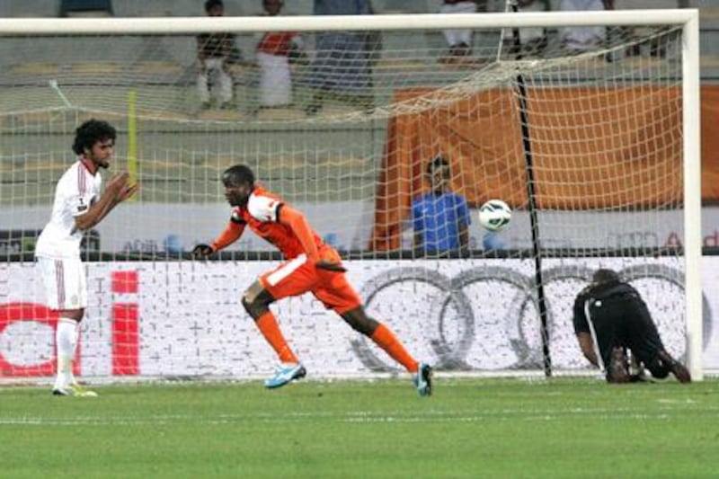 Dubai, United Arab Emirates, May 14, 2013 -  Boris Kabi (center) from Ajman, score the first goal aganist Al Yazira during the Pro League Etisalat Cup final at Al Wasl's Zabeel Stadium. ( Jaime Puebla / The National Newspaper ) 