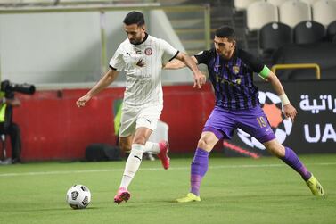 Al Jazira's Ali Mabkhout, left, is challenged by Al Ain defender Mohnad Salem. Courtesy PLC