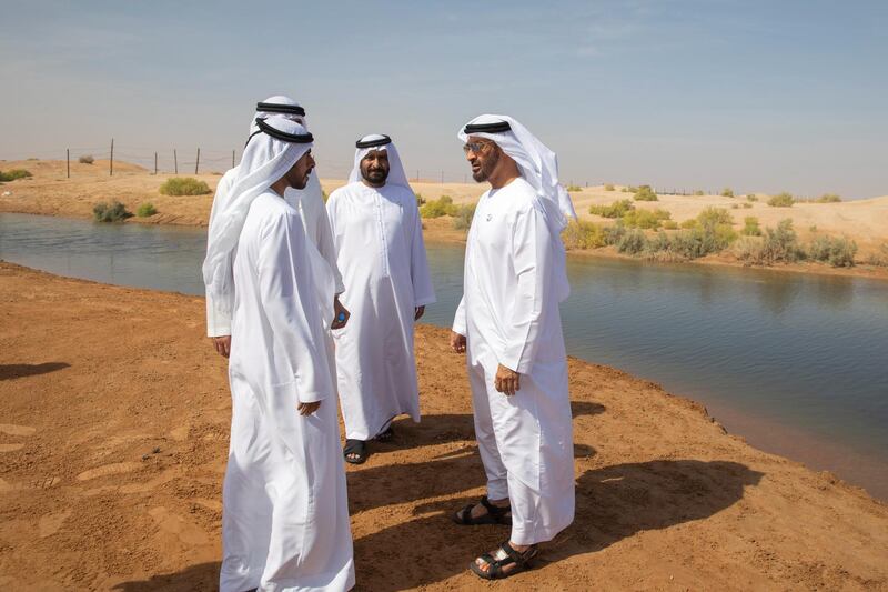 AL AIN, UNITED ARAB EMIRATES - January 16, 2019: HH Sheikh Mohamed bin Zayed Al Nahyan, Crown Prince of Abu Dhabi and Deputy Supreme Commander of the UAE Armed Forces (R), tours Ain Al Fayda lakes. Seen with HH Sheikh Khalifa bin Tahnoon bin Mohamed Al Nahyan, Director of the Martyrs' Families' Affairs Office of the Abu Dhabi Crown Prince Court (L).

( Mohammed Al Blooshi )
---