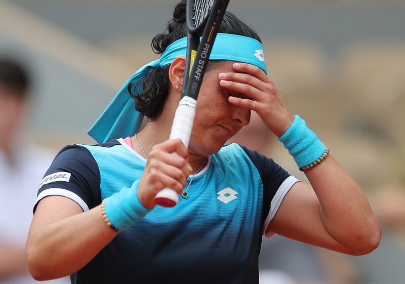 Ons Jabeur expresses her frustration during the French Open first round match against Magda Linette. EPA