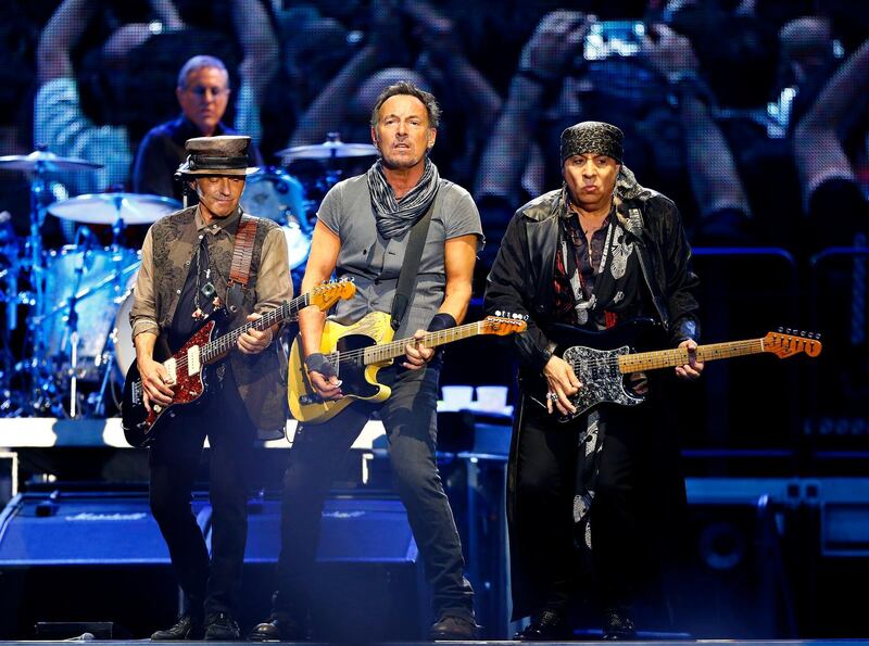 epa05322324 US musician Bruce Springsteen (C) performs on stage during his concert as part of 'The River Tour' at the Santiago Bernabeu Stadium in Madrid, Spain, on 21 May 2016.  EPA/J.P.GANDUL