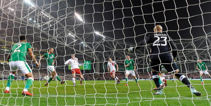 DUBLIN, IRELAND - NOVEMBER 14:  Andreas Christensen of Denmakr (L) shoots and his shot is deflected in by Cyrus Christie of the Republic of Ireland (L) for a own goal and Denmark's first goal of the game during the FIFA 2018 World Cup Qualifier Play-Off: Second Leg between Republic of Ireland and Denmark at Aviva Stadium on November 14, 2017 in Dublin, Ireland.  (Photo by Mike Hewitt/Getty Images)