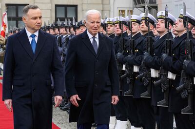 Joe Biden, centre, held talks in Warsaw with Poland's President Andrzej Duda. AFP 