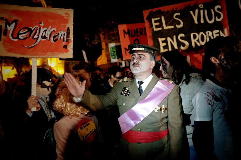 A man dressed up as late Spanish dictator Francisco Franco attends the eighth Halloween Zombie Walk in Alcala de Henares, Madrid, Spain. EPA