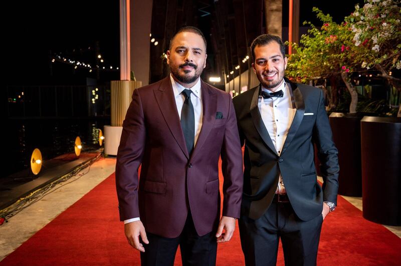 Lebanese singer Ramy Ayach, left, arrives for closing ceremony of the El Gouna Film Festival, in Egypt's Red Sea resort of El Gouna on October 30, 2020. AFP/ El Gouna Film Festival