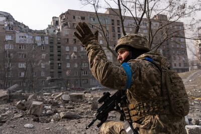 A Ukrainian serviceman guards his position in Mariupol. AP Photo