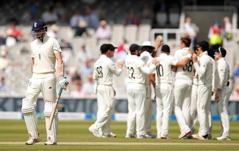 England batsman Zak Crawley trudges off as New Zealand's Tim Southee celebrates after taking his wicket. Reuters