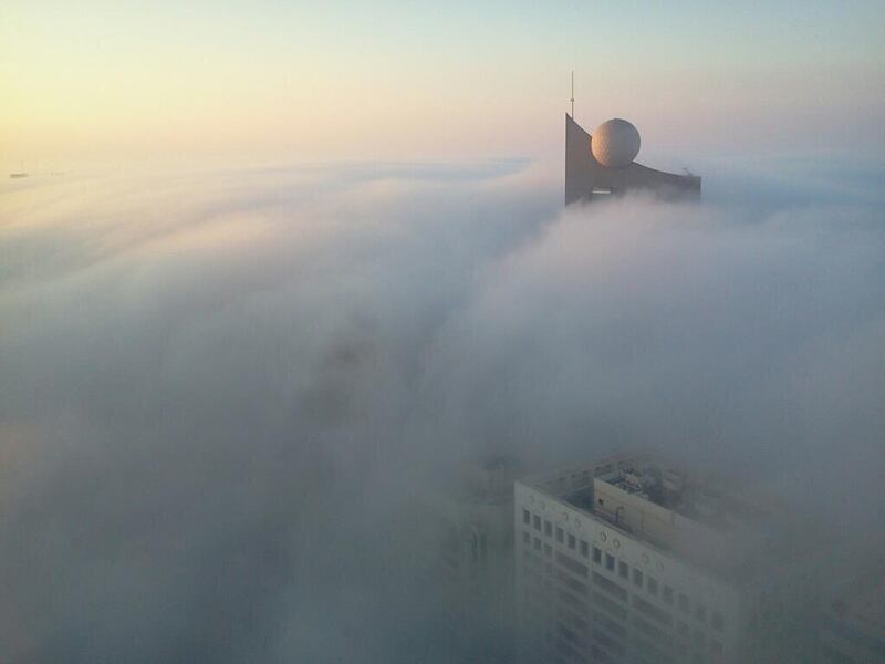 Etisalat headquarters pokes through the fog covering Abu Dhabi. Photo courtesy of Lorna Cole.